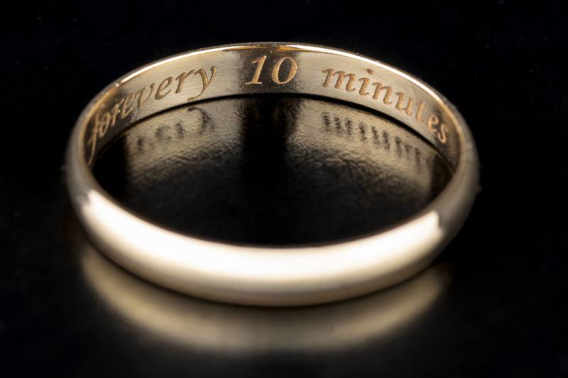 Wedding ring engraved Every 10 Minutes, with the word for crossed out from Forever