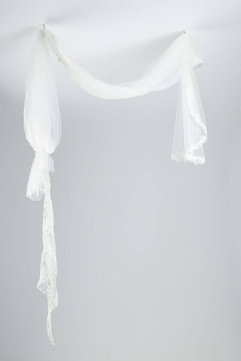 Bridal veils and veil fabric knotted together as an improvised escape rope