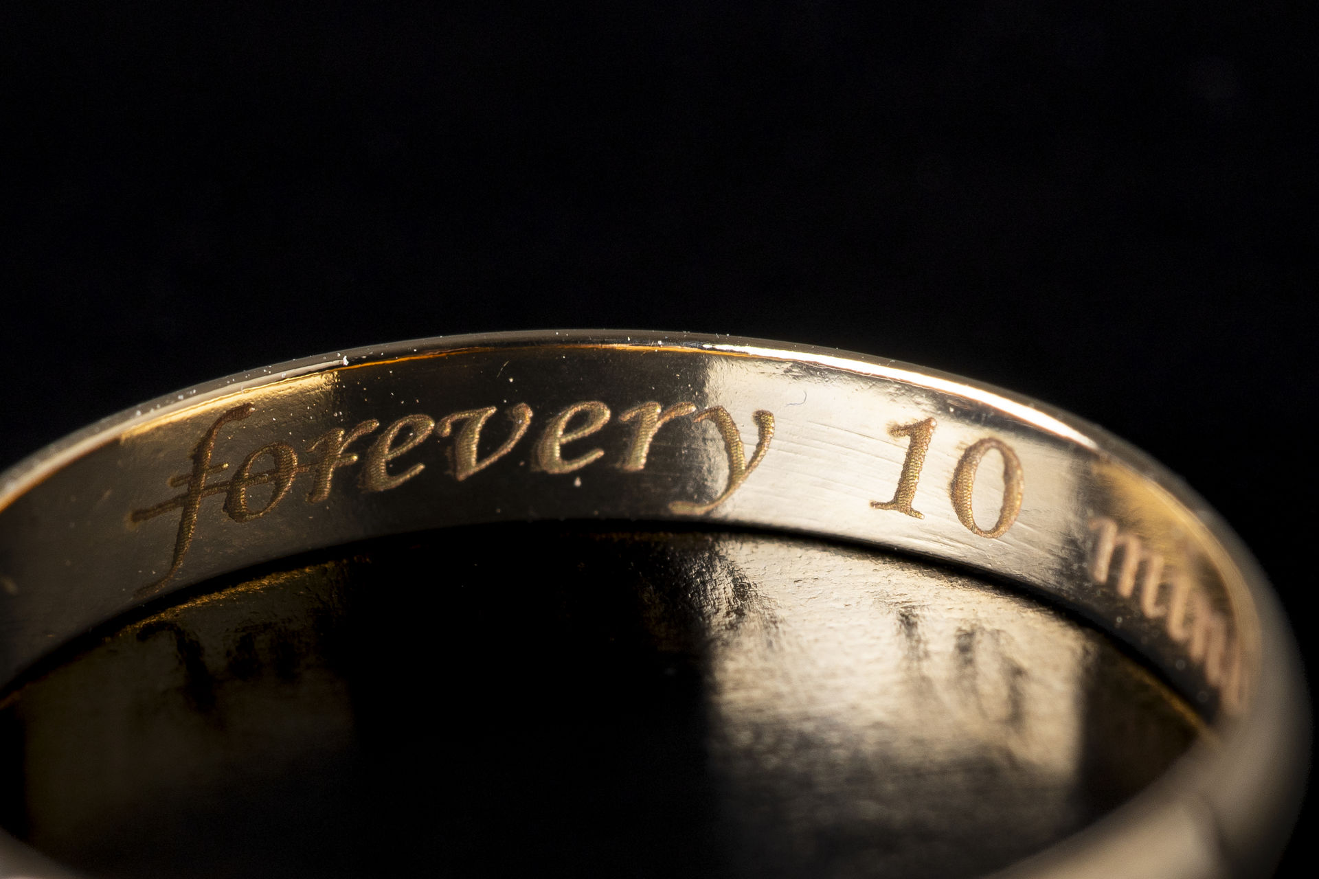 Detail of the altered Every 10 Minutes engraving inside a wedding ring